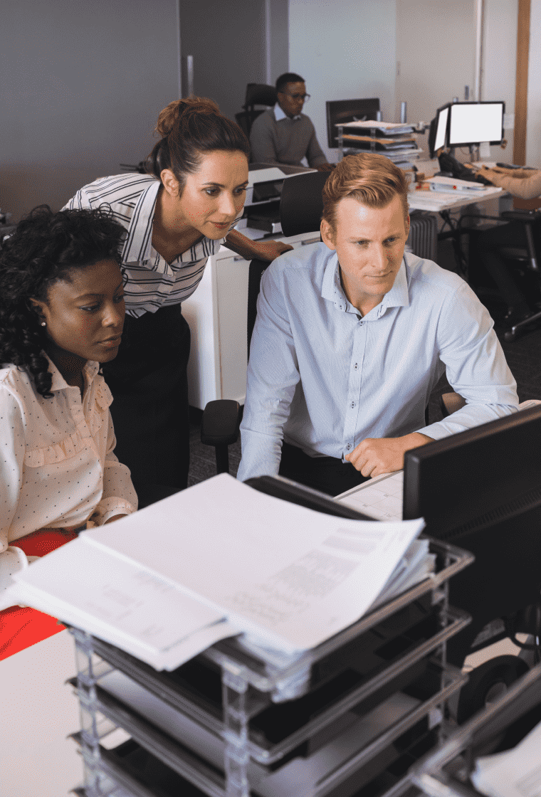 Team analyzing project with a computer